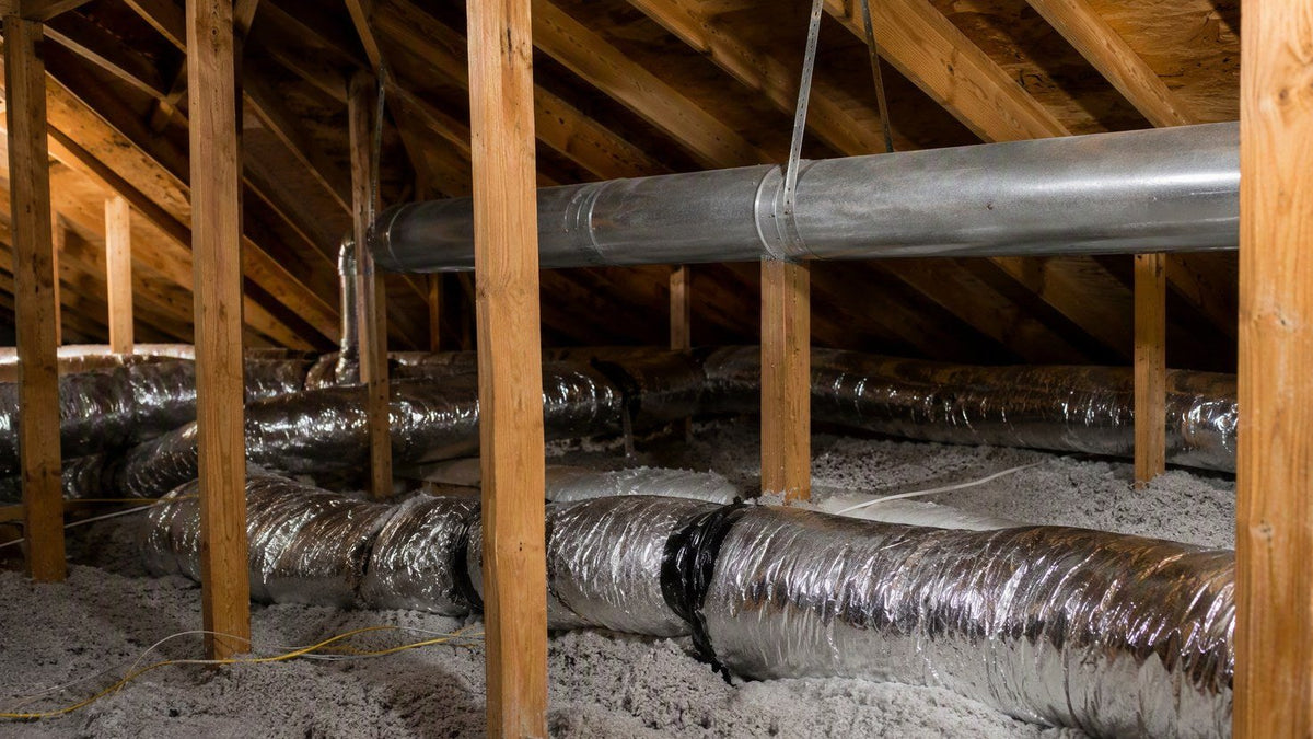 Round sheet-metal and flex HVAC ductwork in a residential attic