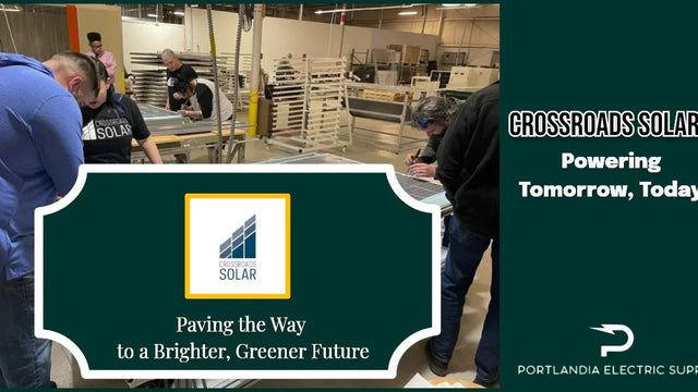 Crossroads Solar workers assembling solar panels in factory, promoting green energy solutions