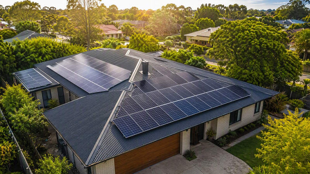 A large residential rooftop fully covered with solar panels on a sunny day