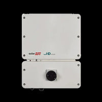 Front view of SolarEdge SE6000H HD-Wave solar inverter with control knob, white casing