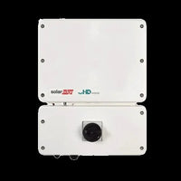 SolarEdge SE6000H HD-Wave inverter front view, white enclosure, black dial, on black background