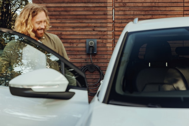Solar panels and electric vehicle charging stations highlighting the role of renewable energy in advancing sustainable transportation.