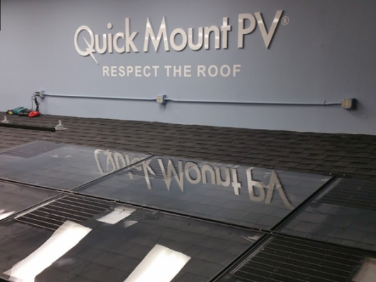 QuickMount rooftop solar mounting system installed on a shingle roof