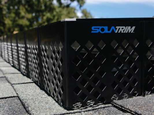 Solar panels protected with SolaTrim barriers against rodents and debris.